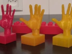 Hand on duplo-compatible block
