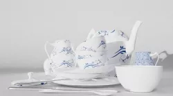 collection of tableware including a vase  plates forks spoons  3D model