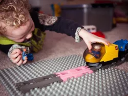 Duplo straight train track rails.