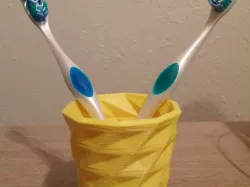 Shapeshifter Toothbrush Cup