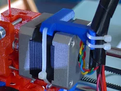 Stepper mounted extruder cable harness strain relief