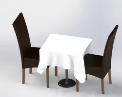 Table with tablecloth and two chairs
