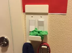 Light switch plate with hooks