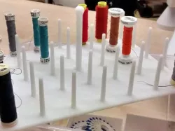 Sewing thread spool holder