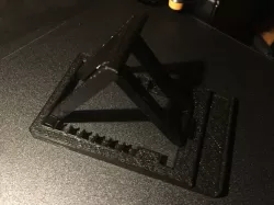 Universal phone/tablet stand with adjustable angle.