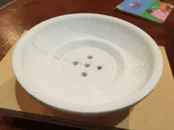 Round soap dish with drain holes