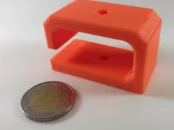 Cable holder for the underside of the desk