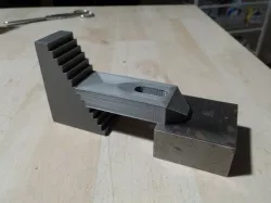 Clamp for T-nut bed with step block