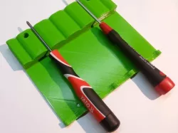 Screwdriver holder (under the shelf)