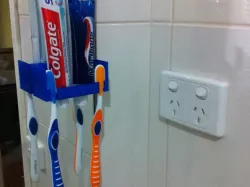 Tooth paste and brush holder