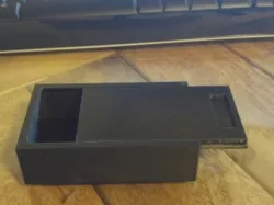 Magnetic key hiding box with sliding lid