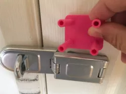 Padlocked sliding door latch mount
