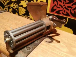 Small rotating, shell ejecting gatling gun