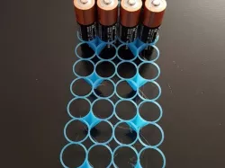 Minimalistic battery holder for AA and AAA batteries