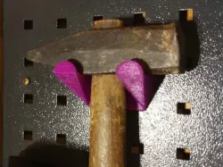Hammer holder for OBI pegboards