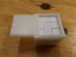 Puzzle cube in a box
