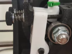 Taz 5 Extruder idler block with added tube holder