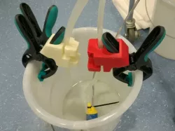 Tube fixture for standard clamp handle