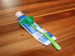 Paste Pusher with Toothbrush Holder