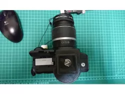 Tripod quick release with battery access