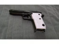 Helwan Cal 9 grips.
