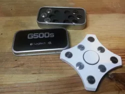 Spinner with logitech mouse weight