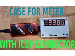 Case for frequency meter with programming connector.