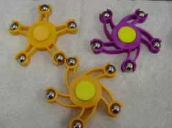 Fidget spinner with 5 spokes and ball bearing weights