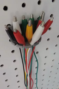 Peg board test lead cable holder
