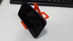 Universal small foldable phone stand with adjustable angle.