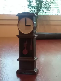 The grandfather clock on the dollhouse