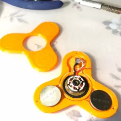 Electric motor fidget spinner