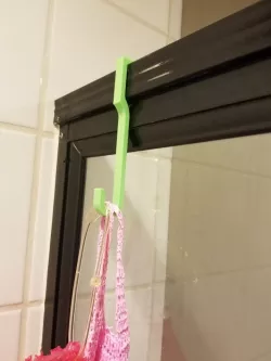 Old glass shower hook