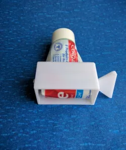 Tooth paste squeezer