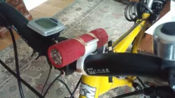 Bracket to attach torch to handlebars