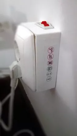 Protected wall socket