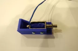 Bracket to mount solenoid for Virtual pinball machine force feedback.