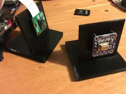 Desktop fixture for official Raspberry Pi Camera, Grid Eye IR sensor breakout, and a Chinese 4-channel relay module