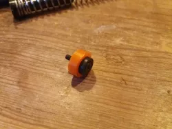 Piston head bearing spacer