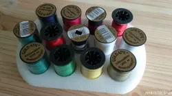 Sewing thread feel holder
