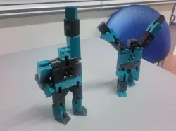 Yossele. String jointed, block robot puzzle
