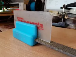Ski wax scraper sharpener