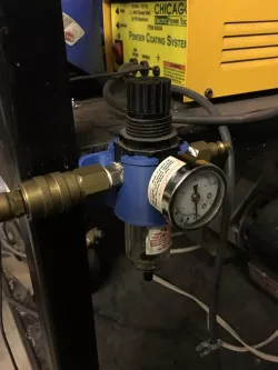 Air compressor regulator and moisture trap