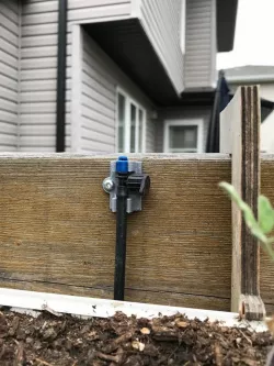Custom holder for irrigation system.