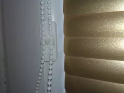 Window blind chain holder