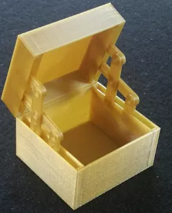 Box with hidden hinge