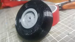 2 inch RC airplane wheel with a 3 mm center hole.