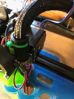 Universal cable strain relief for extruder