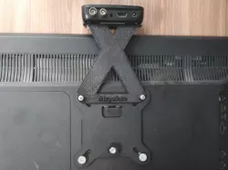 fixing the TV set-top box to the bracket