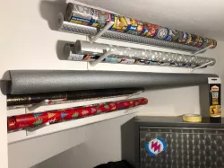 Wrapping paper hook for understairs mounting